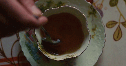 Animation: Hand stirring tea in cup